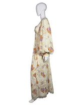 Load image into Gallery viewer, Floral dress on a mannequin against a plain background
