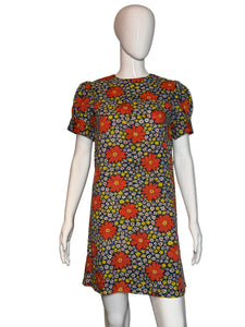 Floral-patterned dress on a mannequin against a plain background