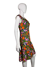 Load image into Gallery viewer, Floral-patterned dress on a mannequin against a plain wall.
