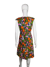 Load image into Gallery viewer, Mannequin wearing a colorful floral dress with a white background

