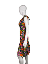 Load image into Gallery viewer, Mannequin wearing a colorful floral dress on a white surface.
