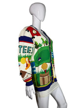 Load image into Gallery viewer, Colorful sweater with golf-themed design on a mannequin against a gray background
