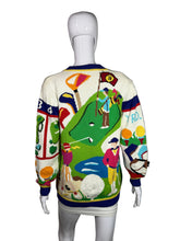 Load image into Gallery viewer, Colorful sweater with golf-themed design on a mannequin against a gray background

