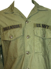 Load image into Gallery viewer, Green military-style jacket with &#39;U.S. Navy&#39; and &#39;Dallacqua&#39; branding on a white background
