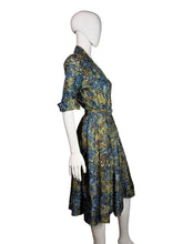 Load image into Gallery viewer, Mannequin wearing a patterned dress against a plain background
