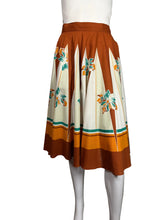 Load image into Gallery viewer, Dress with floral pattern on a mannequin against a plain background
