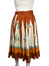 Load image into Gallery viewer, Skirt with a floral pattern on a mannequin against a plain background
