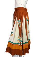 Load image into Gallery viewer, Skirt with a floral pattern on a mannequin against a plain background
