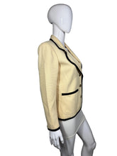 Load image into Gallery viewer, Mannequin wearing a beige jacket with black trim on a plain background

