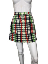 Load image into Gallery viewer, Plaid skirt on a mannequin against a white wall.
