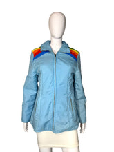 Load image into Gallery viewer, Light blue jacket with rainbow shoulder stripes on a mannequin against a plain background
