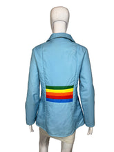 Load image into Gallery viewer, Light blue jacket with rainbow stripe on a mannequin against a neutral background
