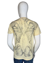 Load image into Gallery viewer, Mannequin wearing a yellow t-shirt with black anatomical design
