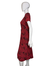 Load image into Gallery viewer, Red floral dress on a mannequin against a white background
