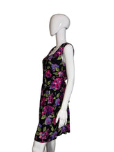 Load image into Gallery viewer, Black romper with colorful floral pattern on a mannequin against a white background
