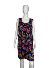 Load image into Gallery viewer, Black romper with colorful floral pattern on a mannequin, shown uncinched against a white background
