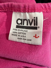 Load image into Gallery viewer, Anvil label on a pink fabric background
