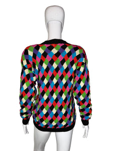 Colorful checkered sweater on a mannequin against a white background
