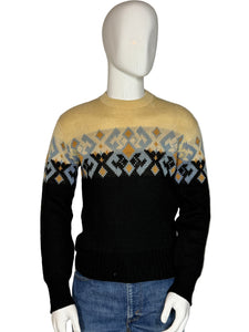 Front view of a mannequin wearing a patterned sweater with blue jeans.