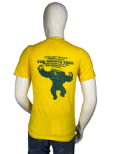 Load image into Gallery viewer, Yellow t-shirt with graphic design on a mannequin against a white background
