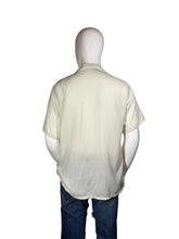Load image into Gallery viewer, Mannequin wearing a light-colored top and dark pants against a plain background
