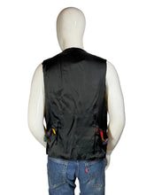 Load image into Gallery viewer, A mannequin wearing a colorful patchwork vest against a white background.
