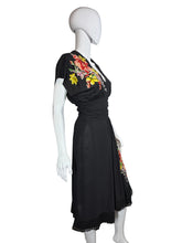Load image into Gallery viewer, Mannequin wearing a black dress with floral embroidery on a white background
