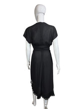 Load image into Gallery viewer, Black dress on a mannequin against a plain wall.
