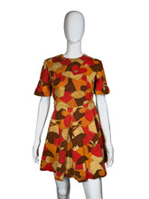 Load image into Gallery viewer, Mannequin wearing a colorful patterned dress against a plain background

