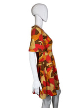 Load image into Gallery viewer, A mannequin wearing a colorful patterned dress against a white background
