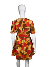 Load image into Gallery viewer, Patterned fabric on a mannequin against a white background
