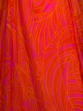 Load image into Gallery viewer, Close-up of vibrant orange and pink fabric with abstract leaf pattern
