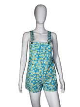 Load image into Gallery viewer, Blue floral overalls on a mannequin against a white background

