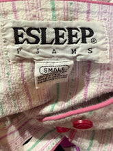 Load image into Gallery viewer, Close-up of a label on a garment with &#39;ESLEEP&#39; text, on a textured fabric background.
