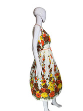 Load image into Gallery viewer, Floral dress on a mannequin against a plain background
