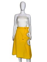 Load image into Gallery viewer, Yellow skirt with a white floral applique against a white background.
