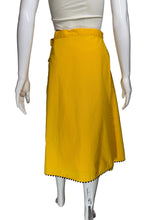 Load image into Gallery viewer, Yellow skirt with a white floral applique against a white background.
