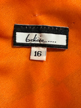Load image into Gallery viewer, Clothing tag with brand name and size on orange fabric

