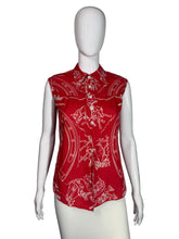 Load image into Gallery viewer, Red patterned blouse on a white mannequin against a plain background
