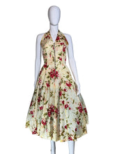 Load image into Gallery viewer, Floral dress on a mannequin against a plain background
