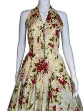 Load image into Gallery viewer, Floral dress on a mannequin against a plain background
