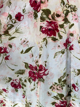 Load image into Gallery viewer, Floral patterned fabric with red and pink flowers on a light background
