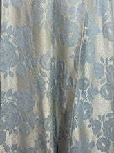 Load image into Gallery viewer, Floral patterned fabric with blue flowers
