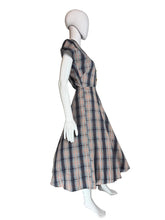 Load image into Gallery viewer, Plaid dress on a mannequin against a plain wall.
