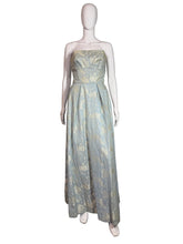 Load image into Gallery viewer, Light blue floral dress on a mannequin against a plain wall.

