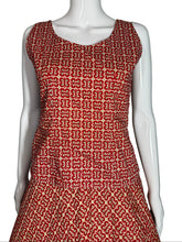 Load image into Gallery viewer, Red patterned fabric on a white mannequin against a plain background
