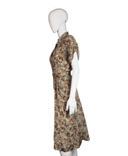 Load image into Gallery viewer, Mannequin wearing a patterned dress with a plain background
