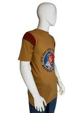 Load image into Gallery viewer, Mannequin wearing a brown t-shirt with a graphic design on the back against a plain background
