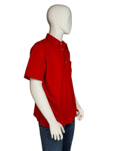 Load image into Gallery viewer, Red polo shirt on a mannequin against a plain background
