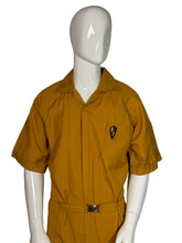 Load image into Gallery viewer, Mannequin wearing a mustard yellow jumpsuit on a white background
